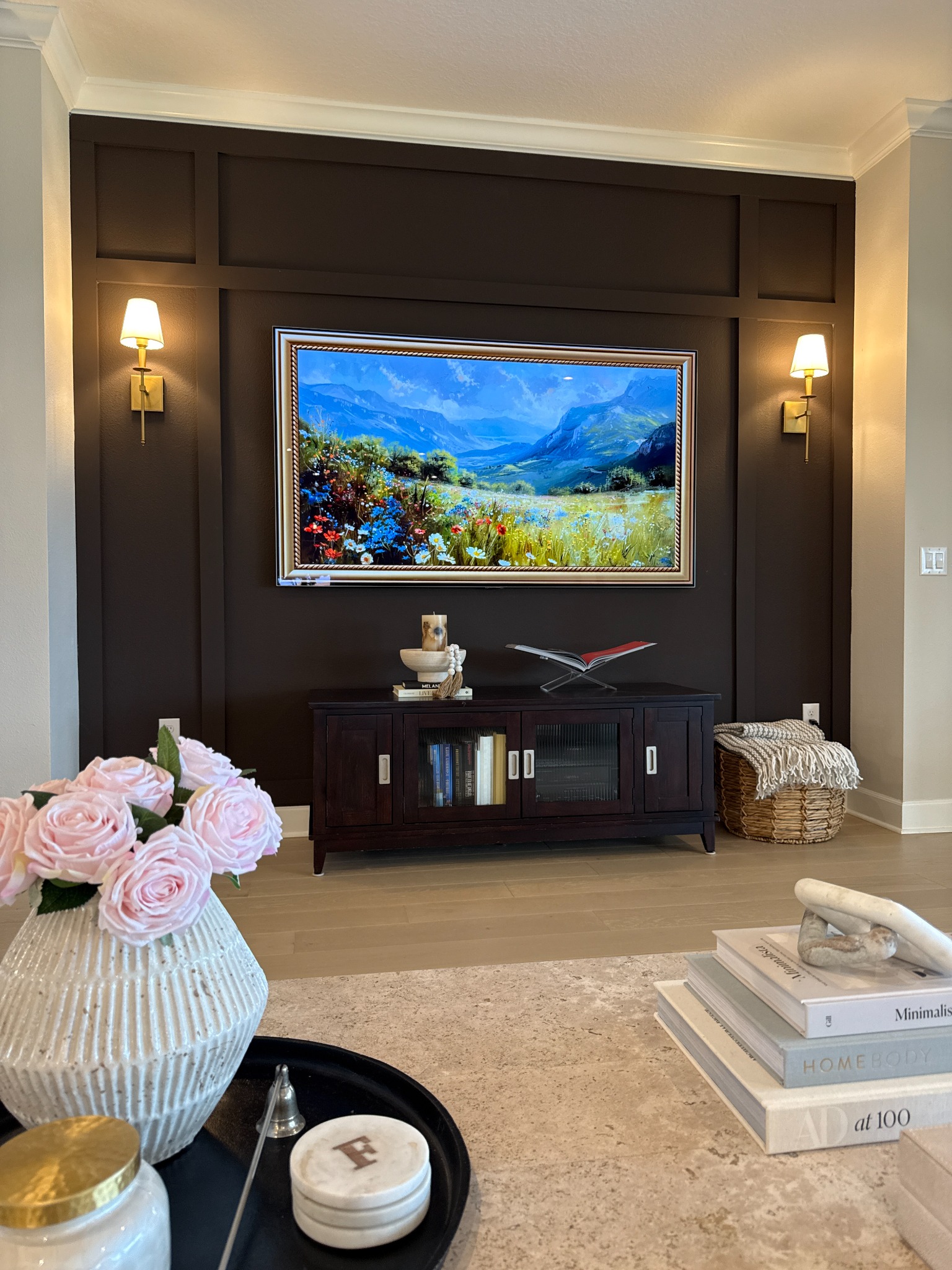 Custom TV accent wall with trim and sconces